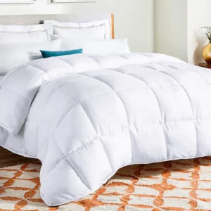 A plush double sized duvet insert in a hotel room setting