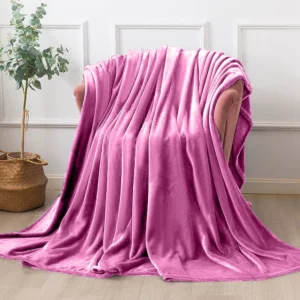 Oversized pink throw blanket draped over furniture