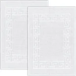 Luxury bath mats with an embossed Greek Key border design.