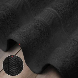 High-GSM Texture on black bath towel for superior absorbency and softness for high volume hospitality environments.