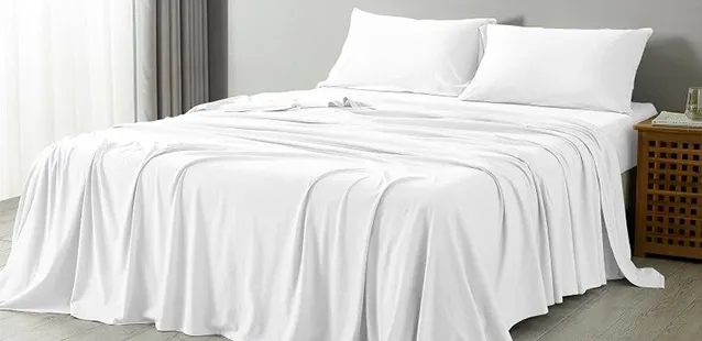 White T-200 premium bedsheets neatly spread on a bed