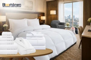 A white binder labeled hotel room checklist lying open on a neatly made white hotel bed with fluffy pillows